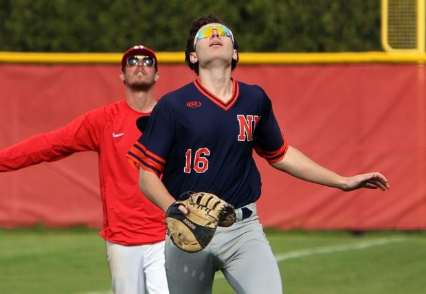 Naperville North's Will Richards catches a popup during the DuPage Valley Conference game against Naperville Central Monday, April 22, 2024, in Naperville. (James C. Svehla/for the Naperville Sun)