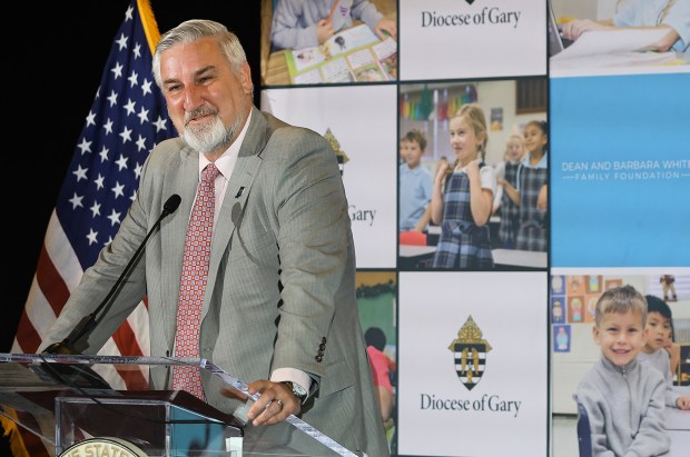 Indiana Governor Eric Holcomb speaks to the crowd during a ceremony where The Dean and Barbara White Family Foundation, Big Shoulders Fund, and the Diocese of Gary is making a $150 million investment over ten years to sustain Catholic schools in Northwest Indiana on Wednesday, June 12, 2024. (John Smierciak/Post Tribune)