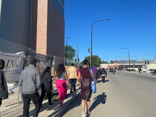 Ald. Colby Chapman marches with Harvey residents toward the city municipal building Monday to protest water bill hikes, business license withholding and a church license ordinance. (Samantha Moilanen/Daily Southtown)