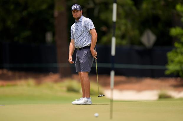 Colin Prater watches his putt on the first hole during a practice round for the U.S. Open on June 12, 2024, in Pinehurst, N.C. (AP Photo/Frank Franklin II)